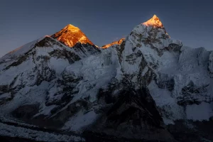 Late orange sunset on summits of Mount Everest and Nuptse